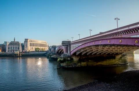 Blackfriars bridge across Thames River and Unilever House early in the mornin Stock Photos