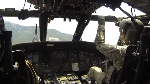 Blackhawk helicopter during missions of dropping buckets of water on fire - 2018 Stock Footage 97525334
