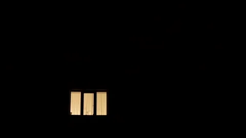Blackout in Ukraine. The only window with light in an apartment building Stock Footage 322197594