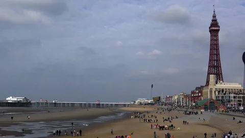 Blackpool beach tower holidaymakers Stock Footage 74145684
