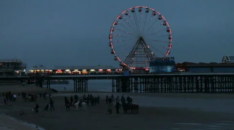 Blackpool pier big wheel donkeys on the beach at dusk Stock Footage 48483300