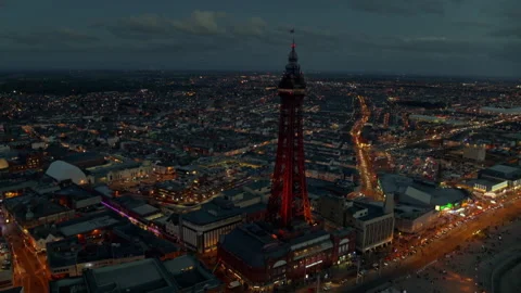Blackpool Tower aerial view at night with city lights Stock Footage 336802942