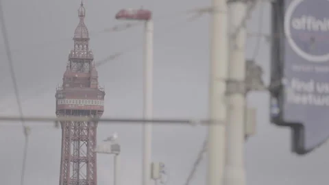 Blackpool tower top through wires and street signage Stock Footage 250884304