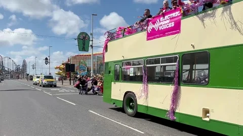 Blackpool, UK 08 June 2024: Rainbow Pride Vintage Trams by the seaside. 4k video Stock Footage 277105393