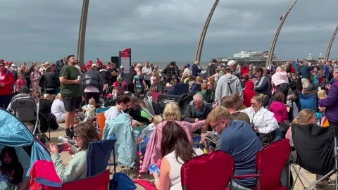 Blackpool, UK 2025 Aug 09; Airshow crowds on the seafront promenade.  4k Video Stock Footage 314590117