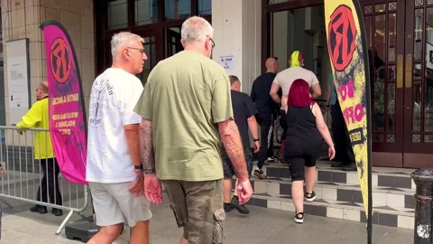 Blackpool, UK 2025 Aug, 10: Rebellion Festival attendees at Box Office entrance Stock Footage 314613009