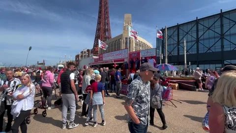 Blackpool, UK. 2025 Aug 10; Airshow crowds on seafront promenade. 4k video Stock Footage 314645444