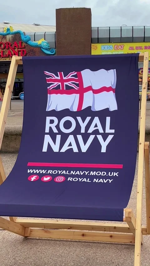 Blackpool, UK 2025 Aug 10; Giant Royal Navy deckchair.  Tower Headland. 4k video Stock Footage 314708231