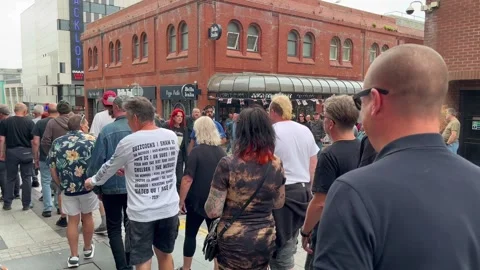 Blackpool UK 2025 Aug 10: Rebellion Punks queuing in line. 4K video Stock Footage 314718833
