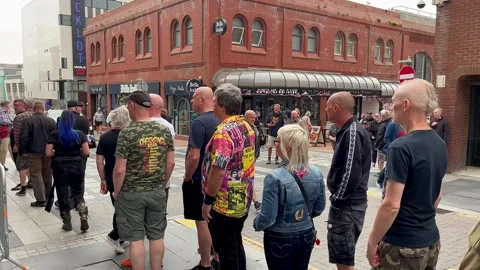 Blackpool UK 2025 Aug 10: Rebellion Punks queuing in line. 4K video Stock Footage 314718859