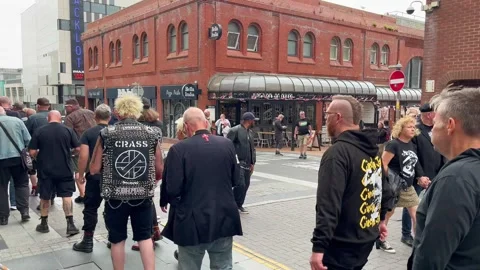 Blackpool UK 2025 Aug 10: Rebellion Punks queuing in line. 4K video Stock Footage 314718967