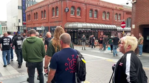 Blackpool UK 2025 Aug 10: Rebellion Punks queuing in line. 4K video Stock Footage 314719067