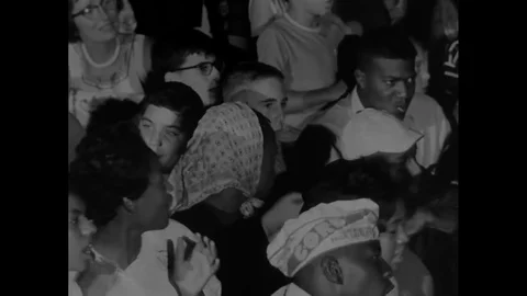 Blacks and whites sing together, advocating the civil rights movement in 1963. Stock Footage
