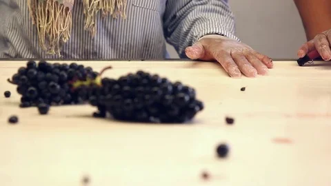Blacks grapes on a triage table Stock Footage 74467102