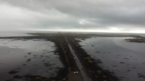 Blacksand beach pan up Stock Footage 223274635
