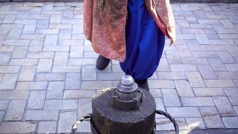 Blacksmith in ancient clothes strikes with a large hammer in Slow Motion. Stock Footage 85213304