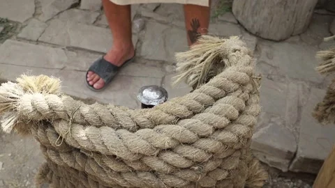 Blacksmith In Ancient Clothes Strikes With A Large Hammer Stock Footage 141366538
