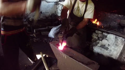Blacksmith and His Apprentice Together Give Form Blank Video stock 59761051
