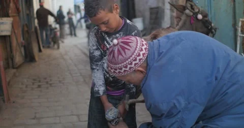 Blacksmith and his son Stock Footage 58659389