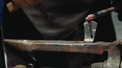 A Blacksmith at the Anvil Using a Hardy Cut Off Tool for Cutting Metal Bar.   스톡 동영상 110836667
