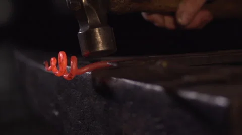 Blacksmith Artist Creating Shape from Steel Stock Footage 67341183