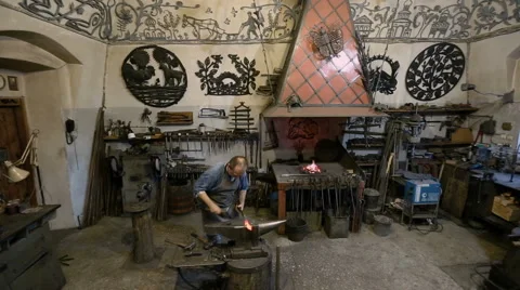 Blacksmith in the blacksmith shop Stock Footage 67738388