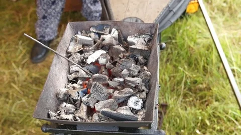 Blacksmith blows coals Stock Footage 78275352