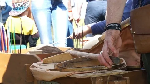 Blacksmith blows coals Stock Footage 78984616