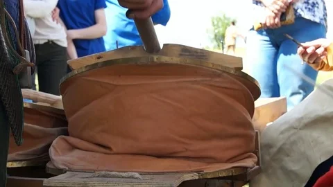 Blacksmith blows coals Stock Footage 78984636