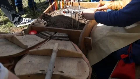 Blacksmith blows coals Stock Footage 78984651