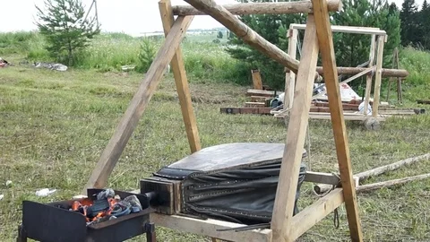 Blacksmith blows coals Stock Footage 78984676