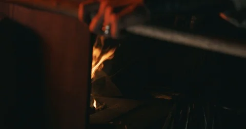 Blacksmith blows fire with antient bellows (windbag) 01 (color graded) Stock Footage 126967613