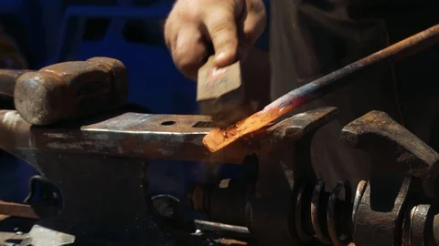 The blacksmith brushes the metal from scale by hand. The blacksmith manually  스톡 동영상 110836623
