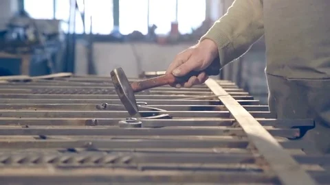 Blacksmith checks of welds metal in the forge hammer Stock Footage 77005348