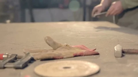 The blacksmith compares detail of layout Stock Footage 77028560