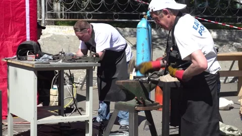 Blacksmith Competition at Folk Crafts Fair Stock Footage 342700671