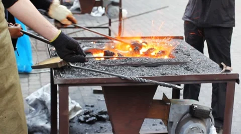 Blacksmith Corrects Coal Video stock 8659544