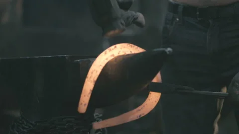 Blacksmith creates a horseshoe shape Stock Footage 109599757