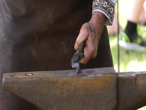 Blacksmith creating sharp weapon slow motion hammering 4k Stock Footage