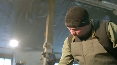 Blacksmith draws a chalk sketch on the table Stock Footage 76362633