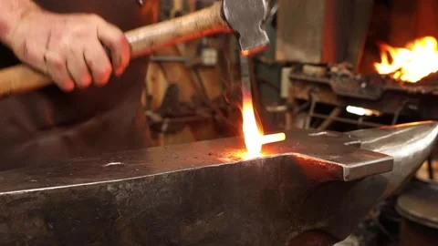 Blacksmith fire welding a hinge pintle Stock Footage 153500881