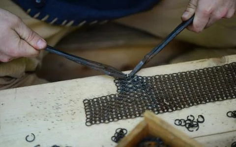 Blacksmith fixing the armor Stock Photos