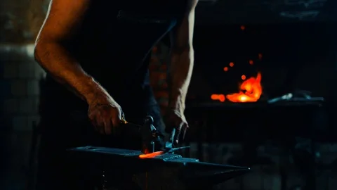 Blacksmith forge blank on anvil and fire in the furnace on background Video stock 127882674