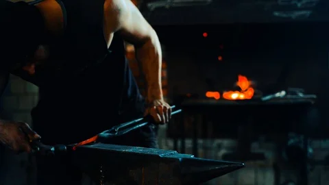 Blacksmith forge blank on anvil and fire in the furnace on background Stock Footage 127882676