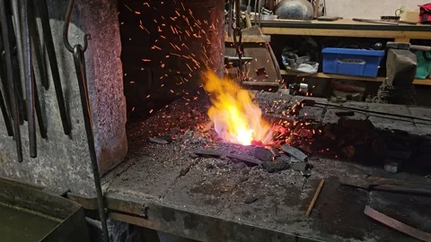 Blacksmith Forge Fire in Rustic Metalworking Workshop With Glowing Coal Video stock 333135894