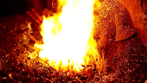 Blacksmith, forge. Old blacksmith working metal with hammer on the anvil. Stock Footage 150735368