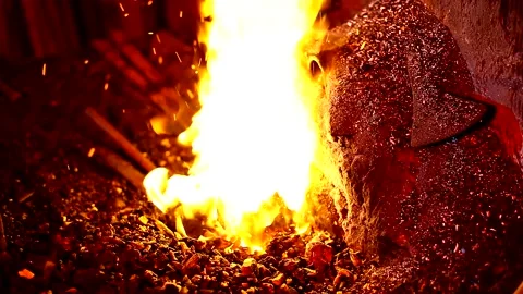 Blacksmith, forge. Old blacksmith working metal with hammer on the anvil. Stock Footage 150735806