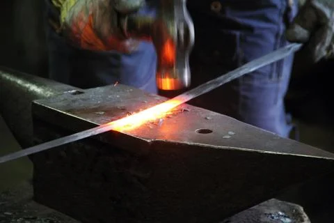 Blacksmith in a forge Stock Photos