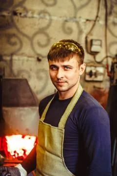 The blacksmith is at the forge Stock Photos