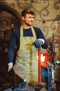 The blacksmith is at the forge Stock Photos